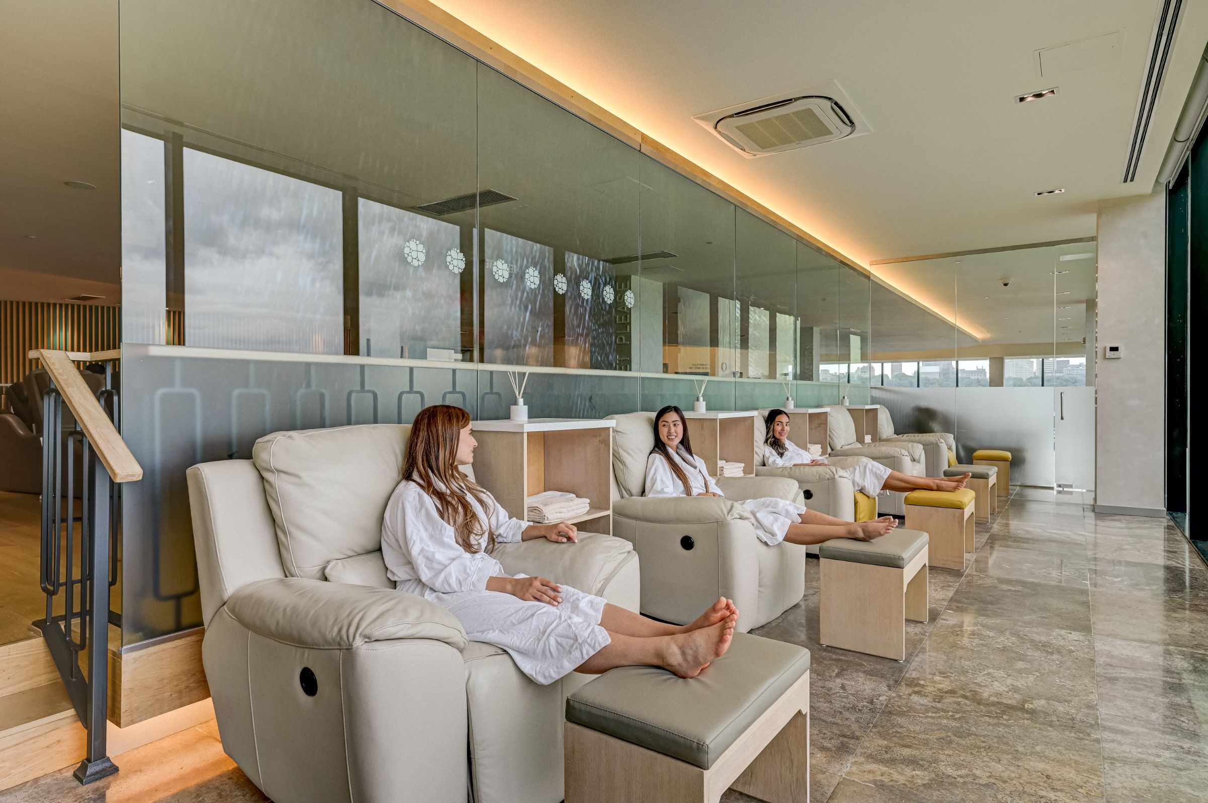 A group of 3 women wait for their spa reservation