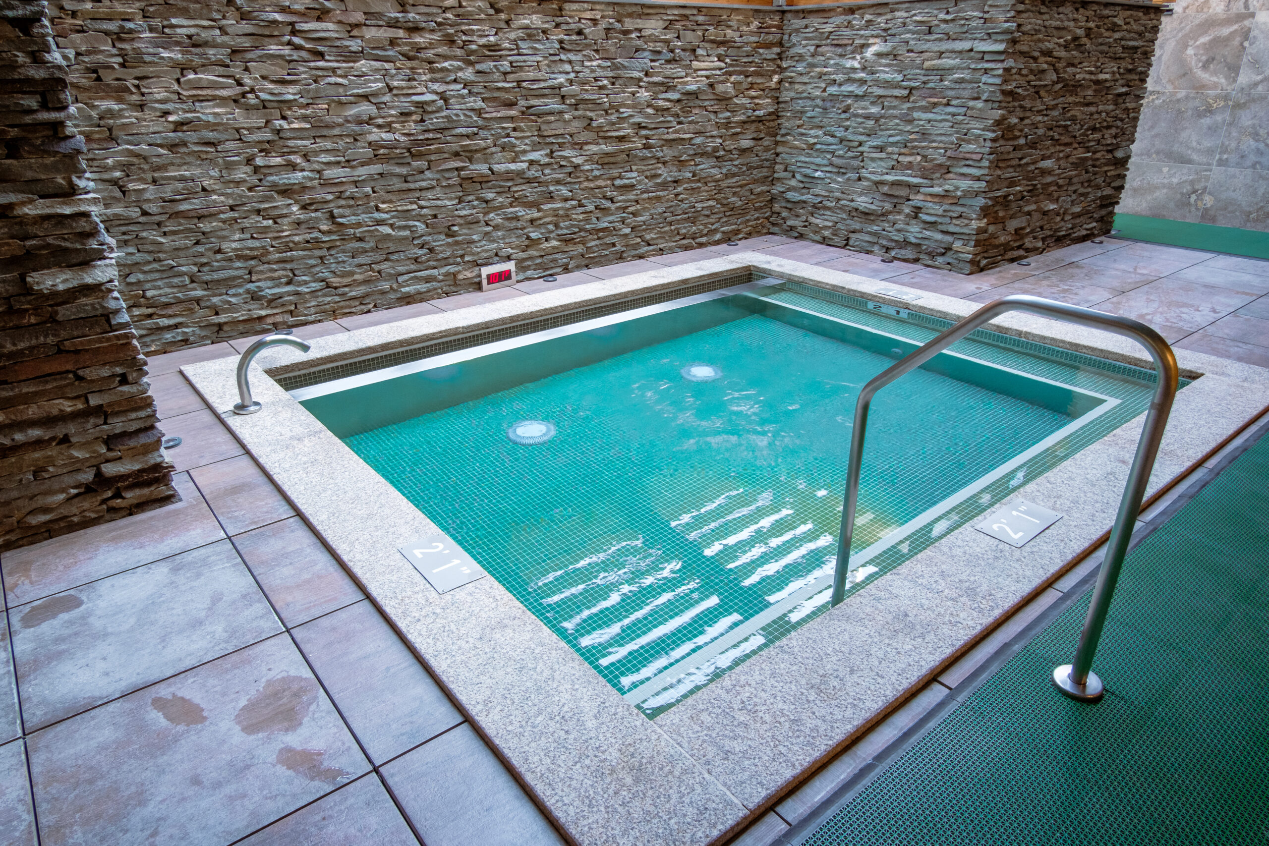 Gender-specific outdoor bath located in a bath house.