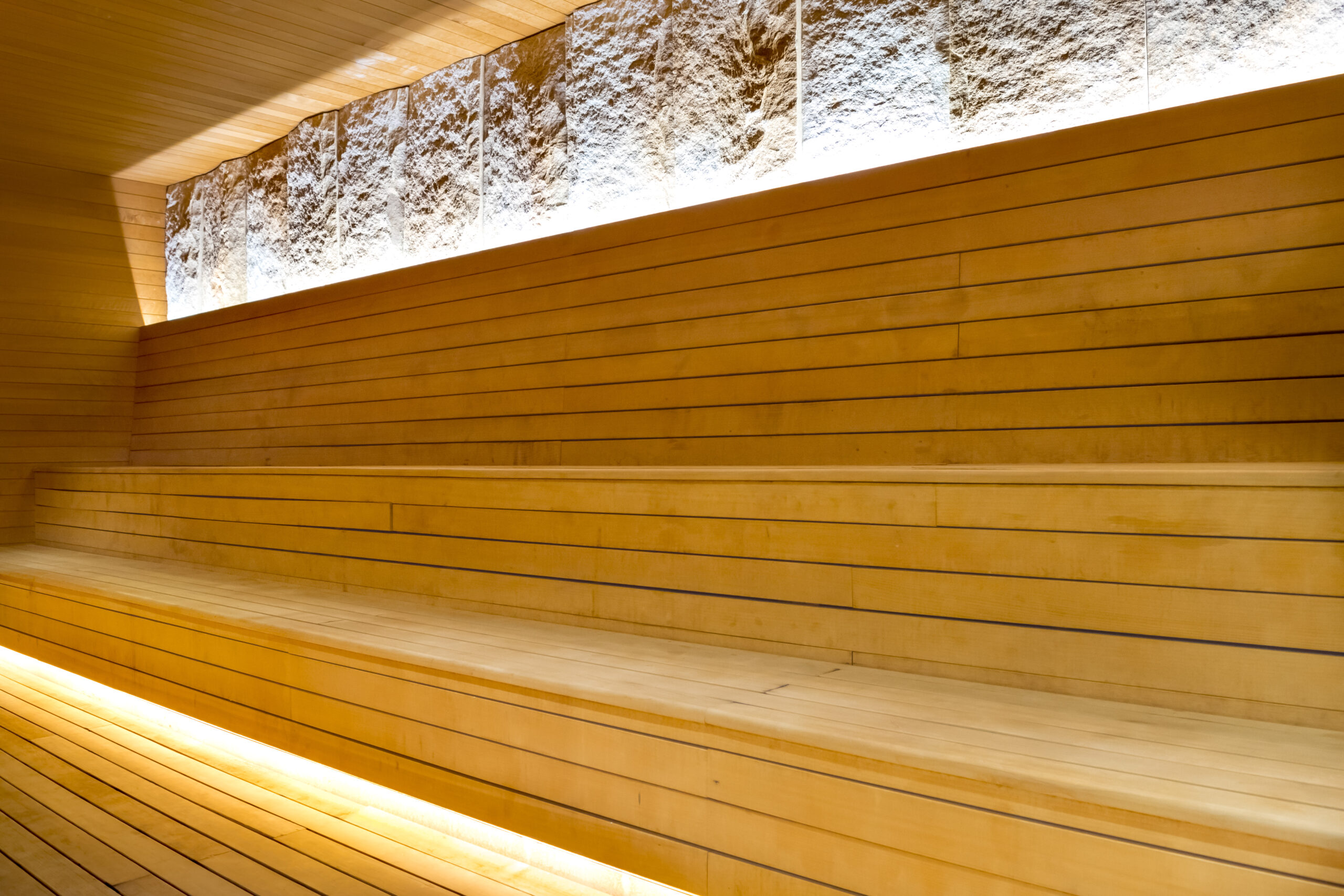 Wooden benches inside a dry sauna at SoJo Spa Club