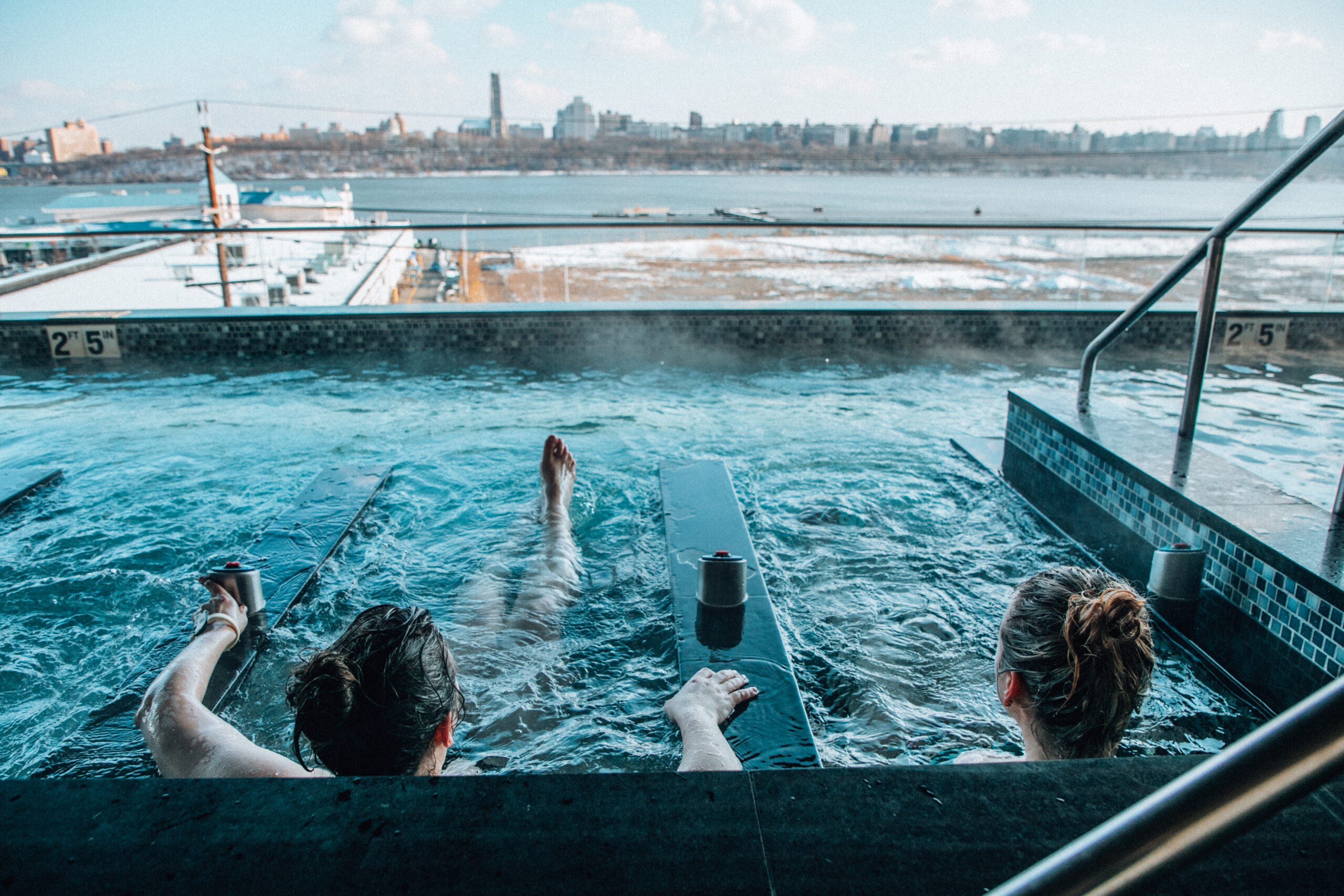 View of the hydrotherapy pool with two women enjoying winter at SoJo